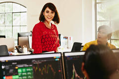 woman talking to her colleague in an open space