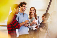 Group of people laughing and talking together