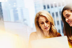 Two women working together