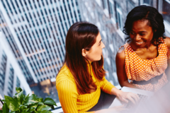 2 woman sitting by the windows