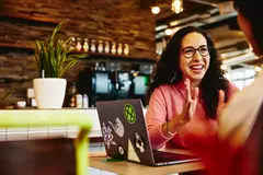 Close up - Smiling female talking to someone.
