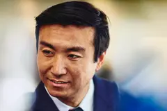 Close up - male smiling looking away
