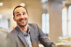 Male looking up in an office
