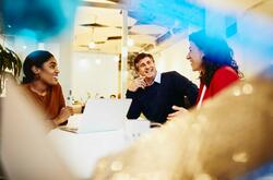 group conversation in a boardroom