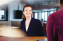 Two women and a man having a meeting