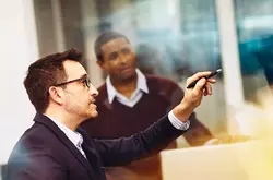 Two men working together in an office
