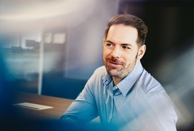 man in office smiling