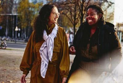 two girls talking in the park