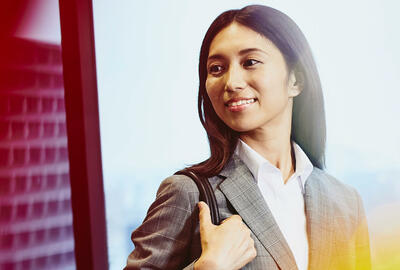 Close up - Woman smiling looking away