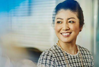 Close up - Smiling woman looking away
