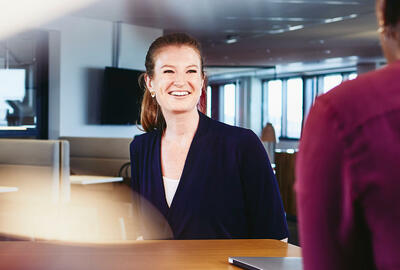 Two women and a man having a meeting