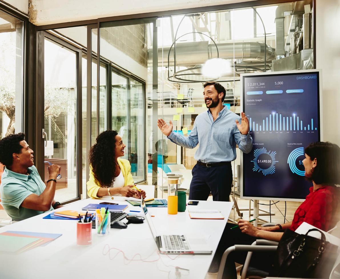 employee making a presentation to his colleagues