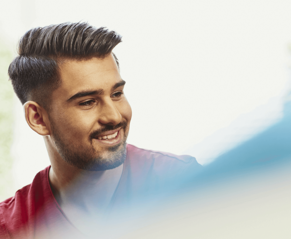 man looking to the side smiling