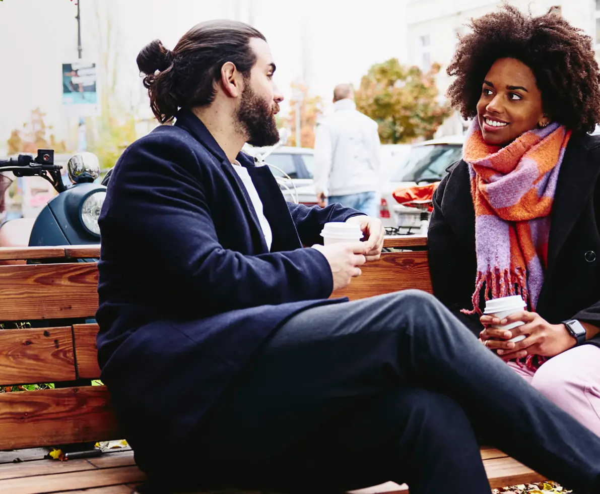 2 colleagues sitting on a bench