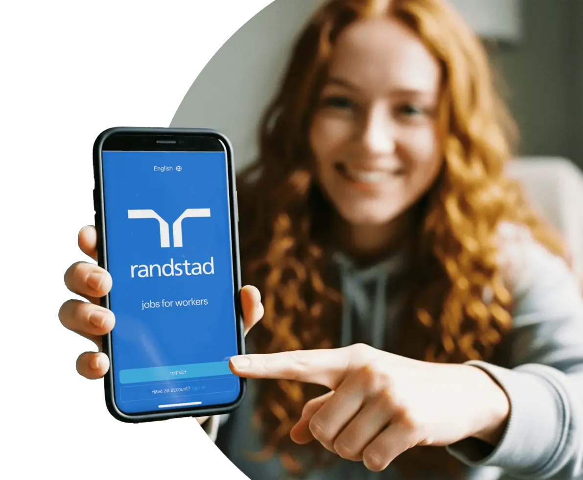 gen z worker holding a phone display the Randstad App