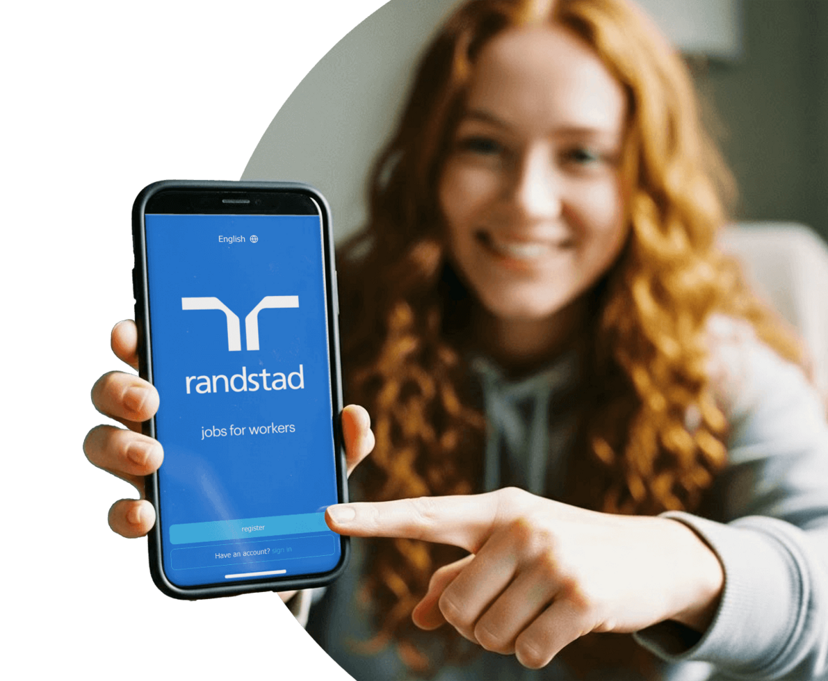 gen z worker holding a phone display the Randstad App