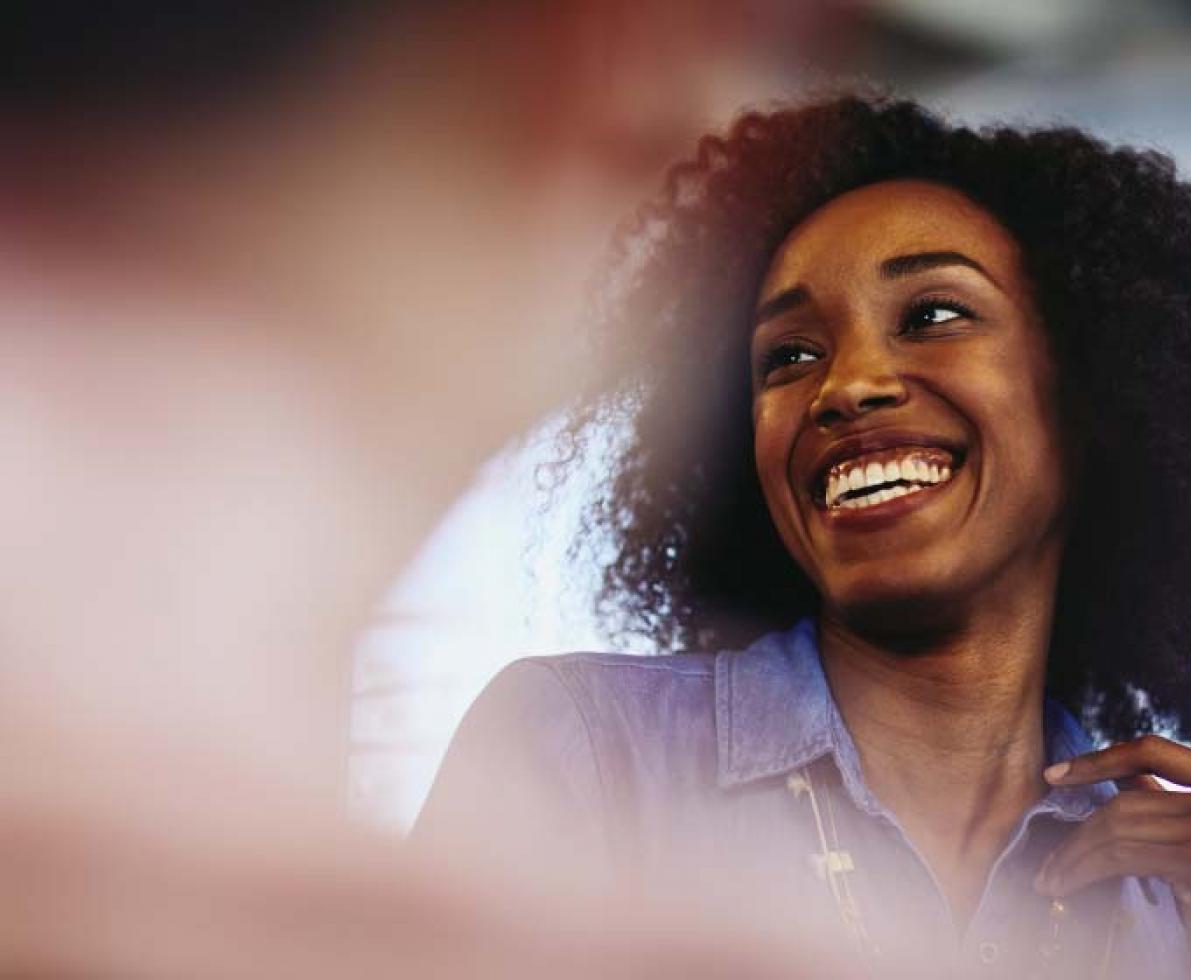 Close up - Smiling woman looking away