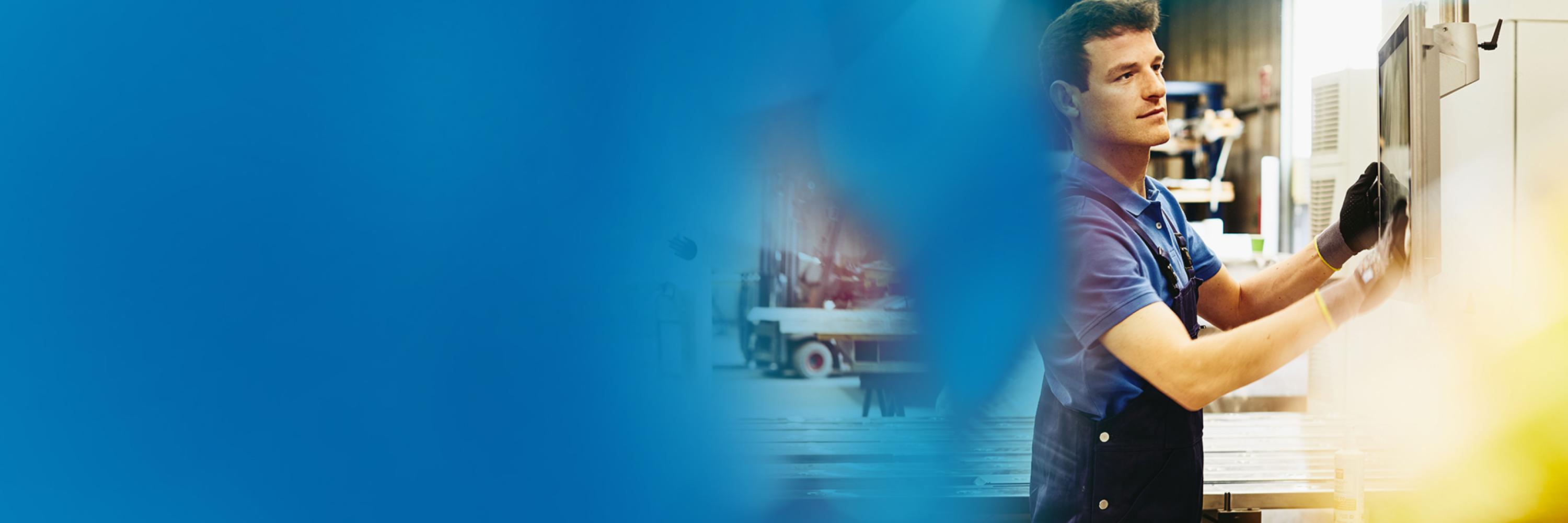 Man cleaning a screen at a production site