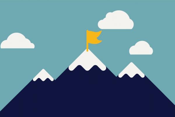 mountain with snow caps and flag on top