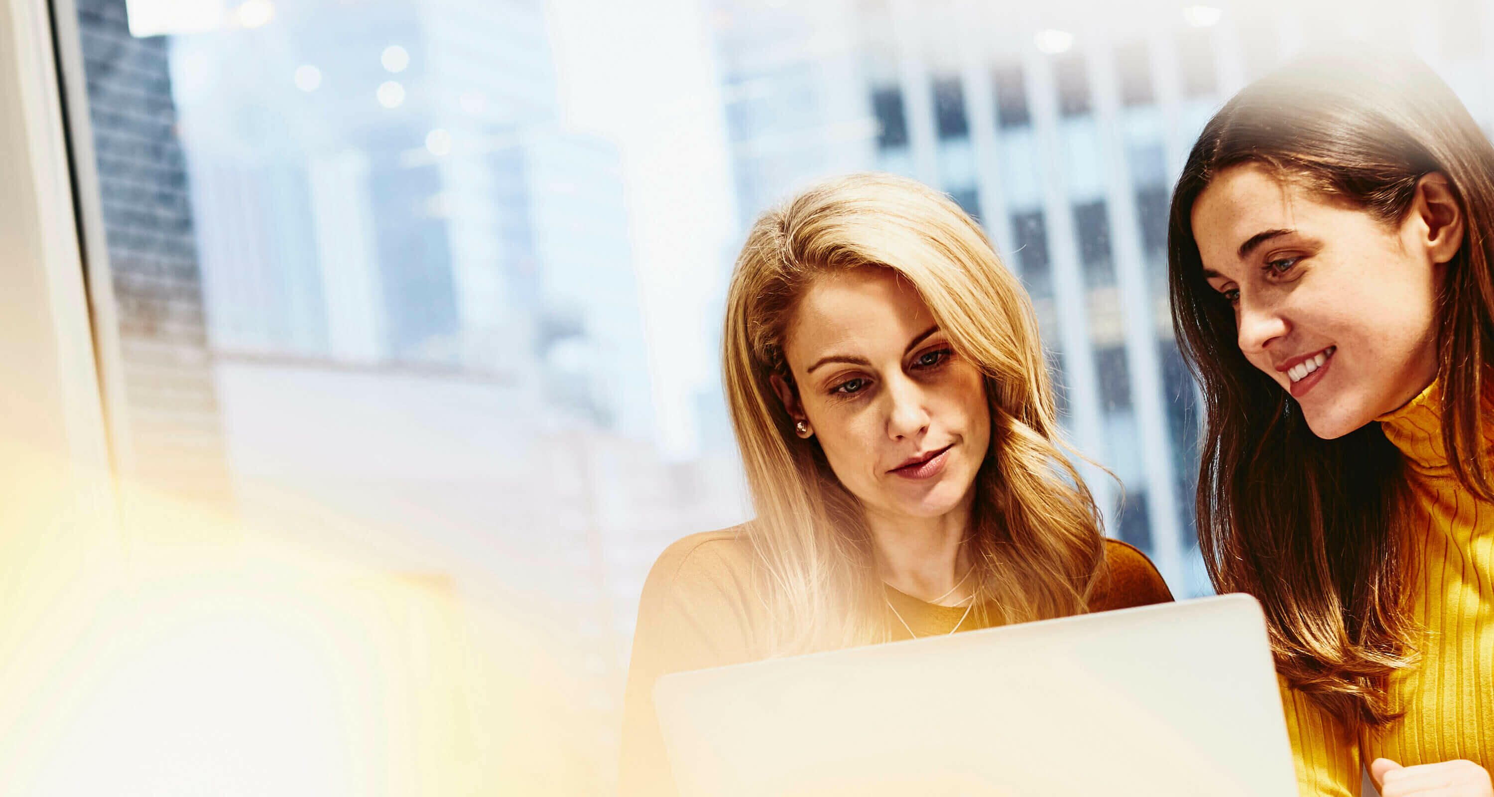 Two women working together